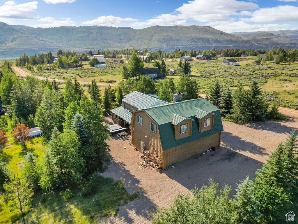Aerial view featuring a rural view and a mountain view