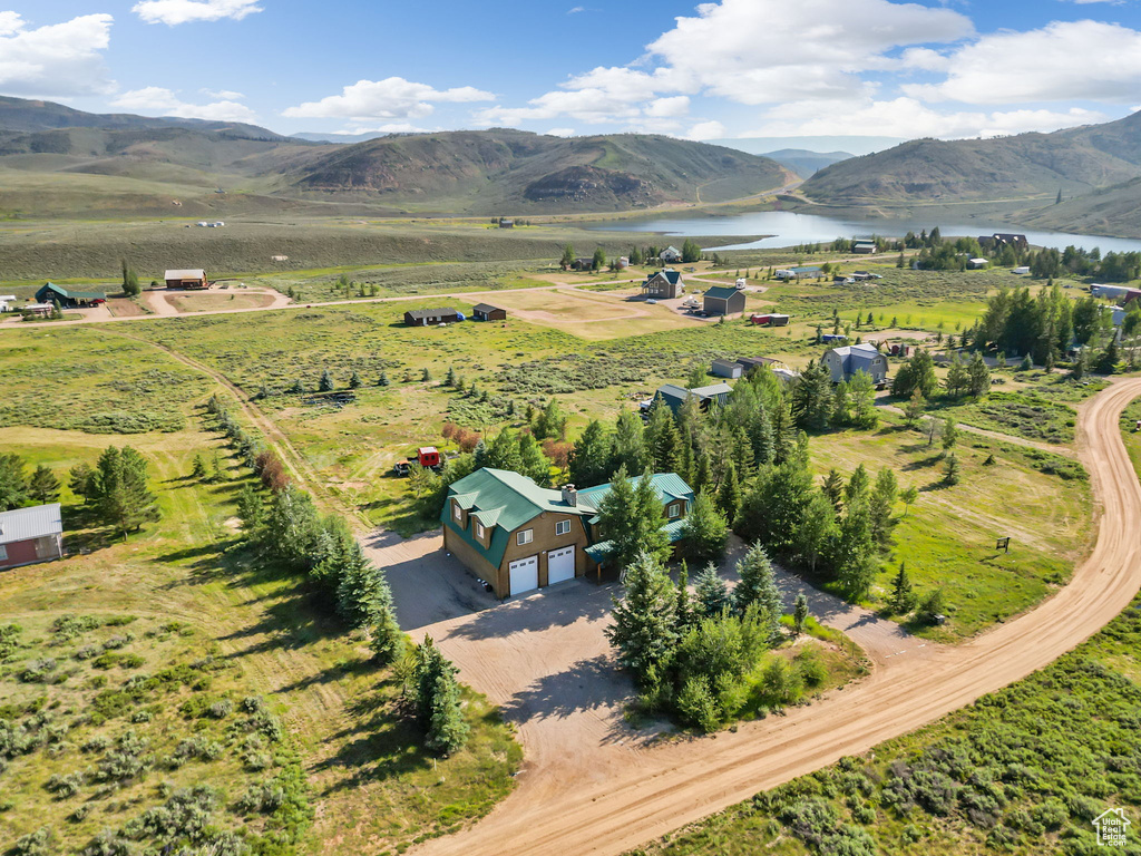Bird's eye view with a rural view and a water and mountain view