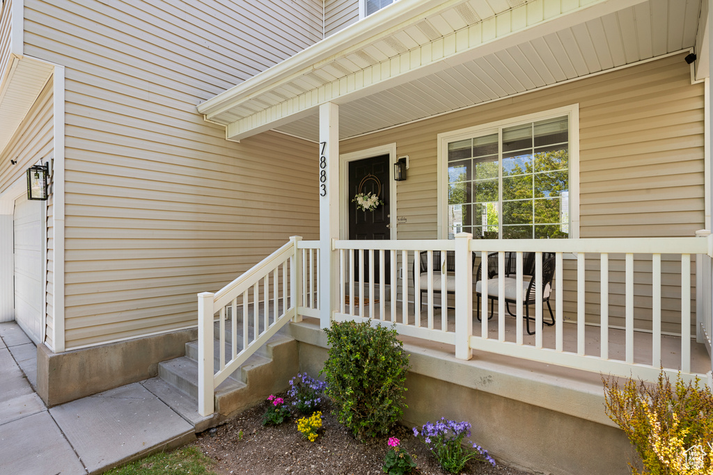 View of exterior entry with covered porch