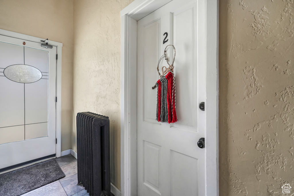 Doorway to property with radiator heating unit
