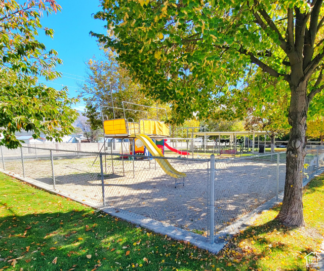 Community jungle gym featuring fence