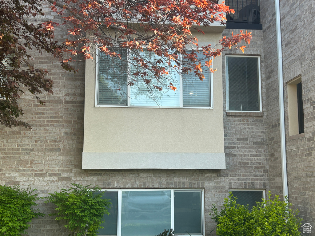 View of side of property featuring stucco siding