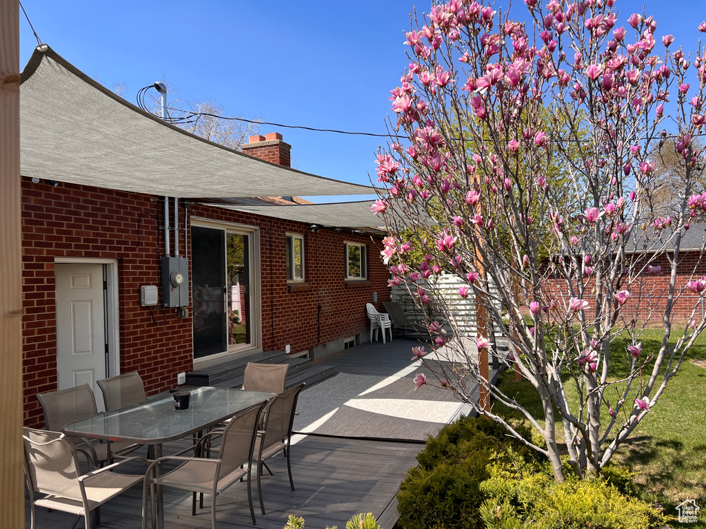 Wooden deck featuring outdoor dining area