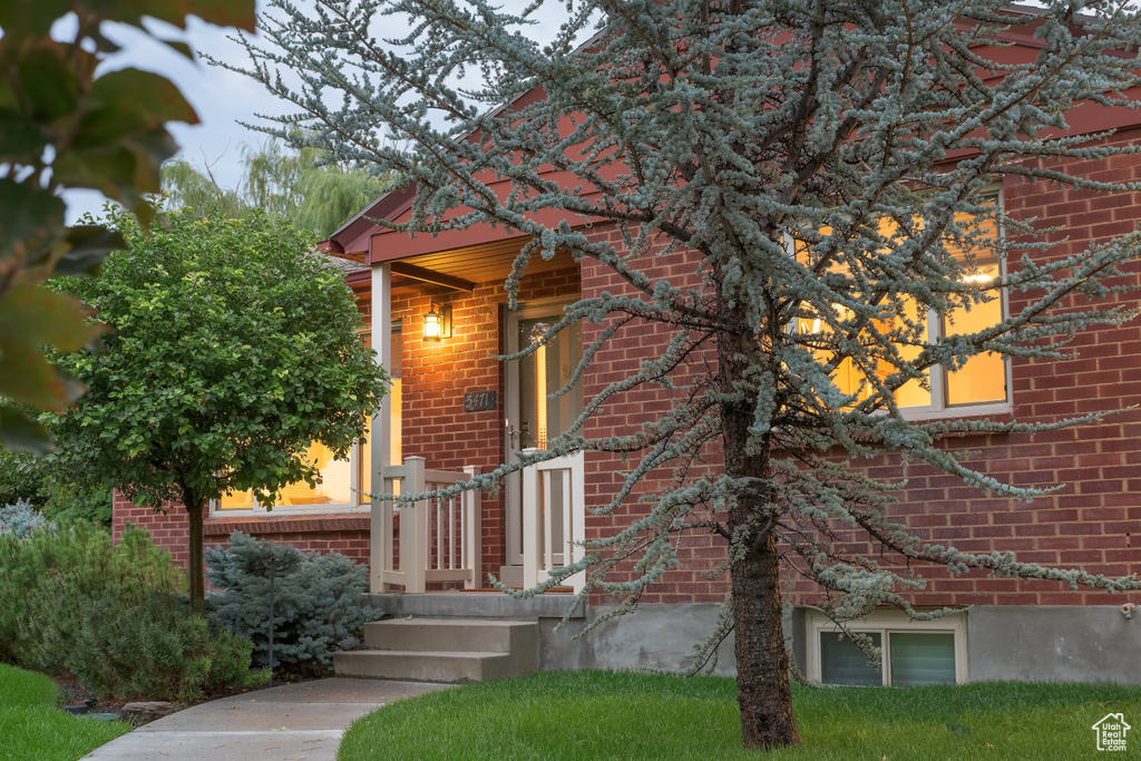 View of property exterior with brick siding