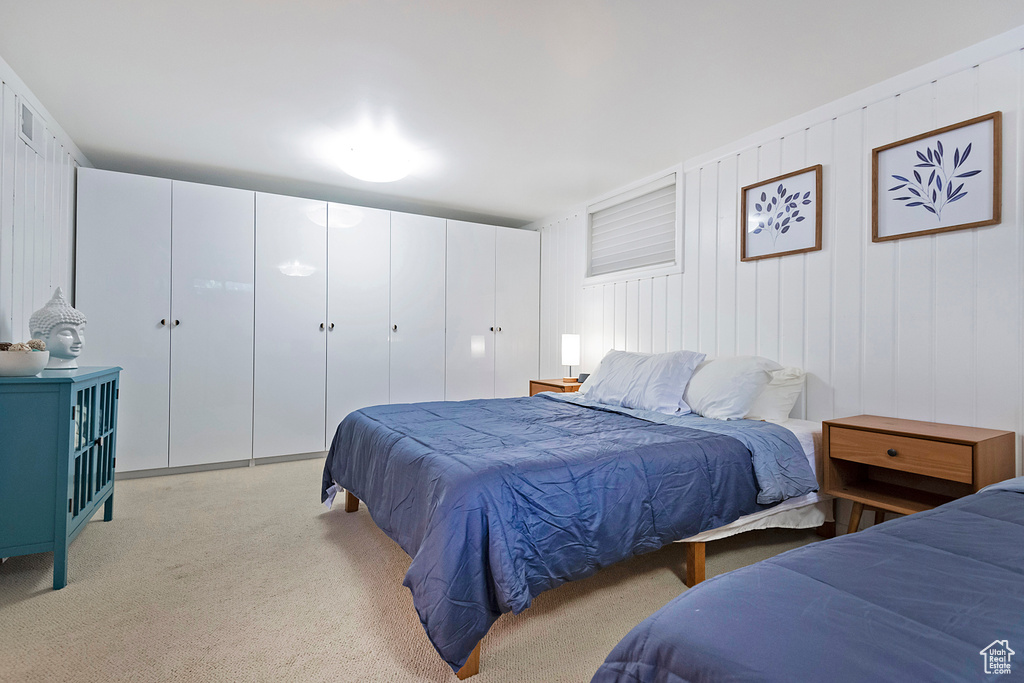 Bedroom with light colored carpet