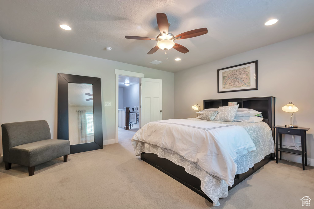 Bedroom with baseboards, light carpet, a ceiling fan, and recessed lighting