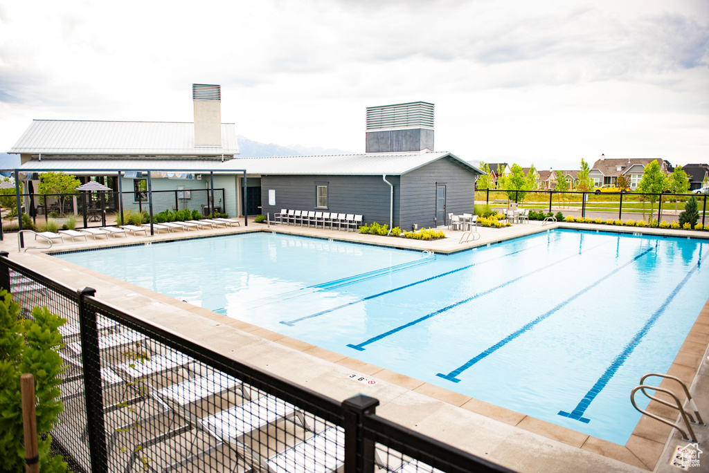 Community pool featuring fence