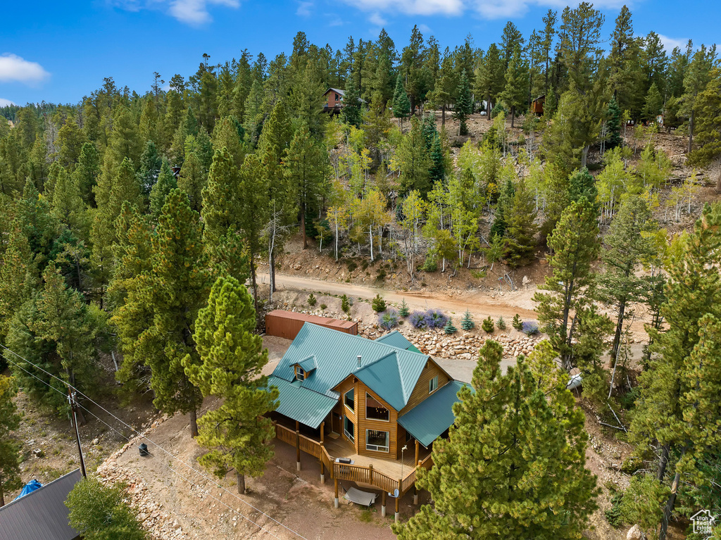Aerial view featuring a view of trees