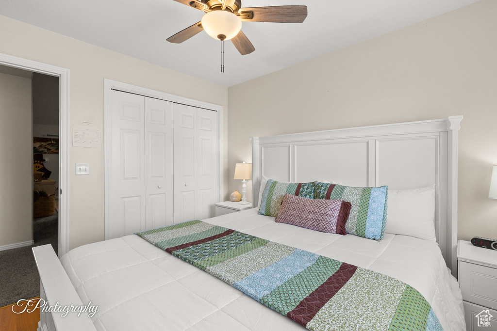 Bedroom with a ceiling fan and a closet