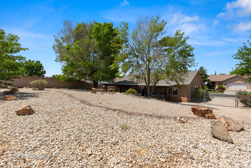 View of yard with a gate and a fenced backyard