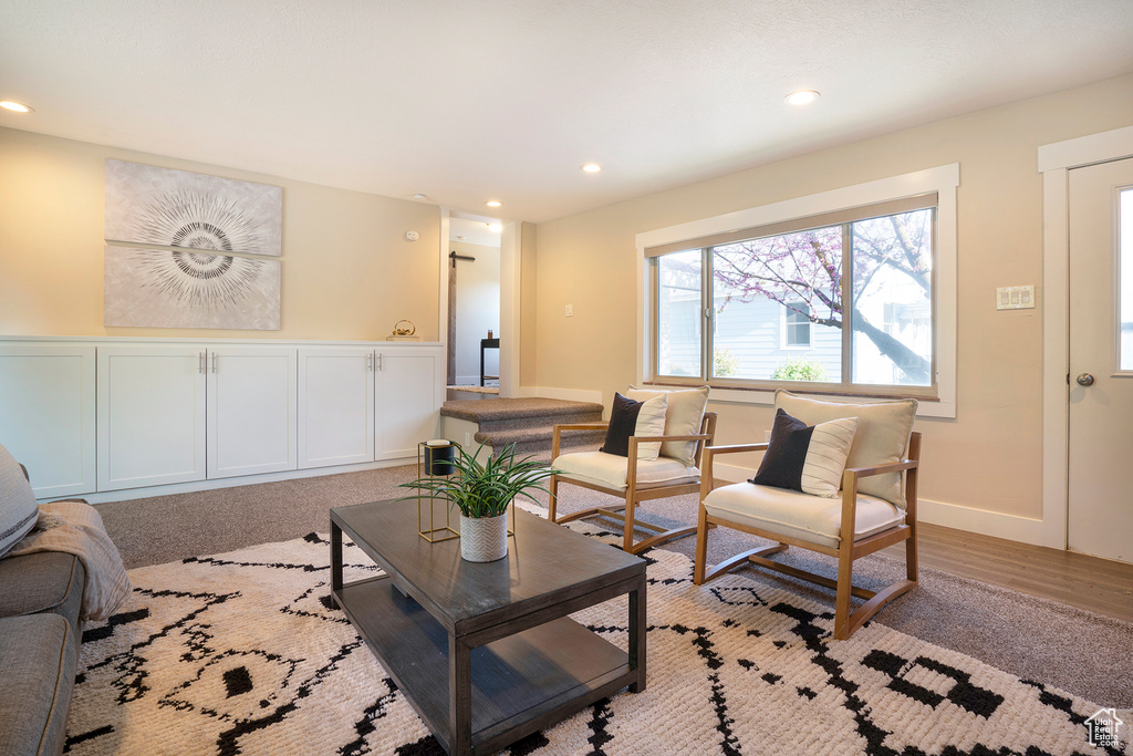 Living area featuring recessed lighting and light wood-type flooring