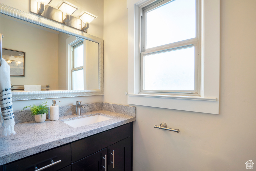 Bathroom with vanity and plenty of natural light