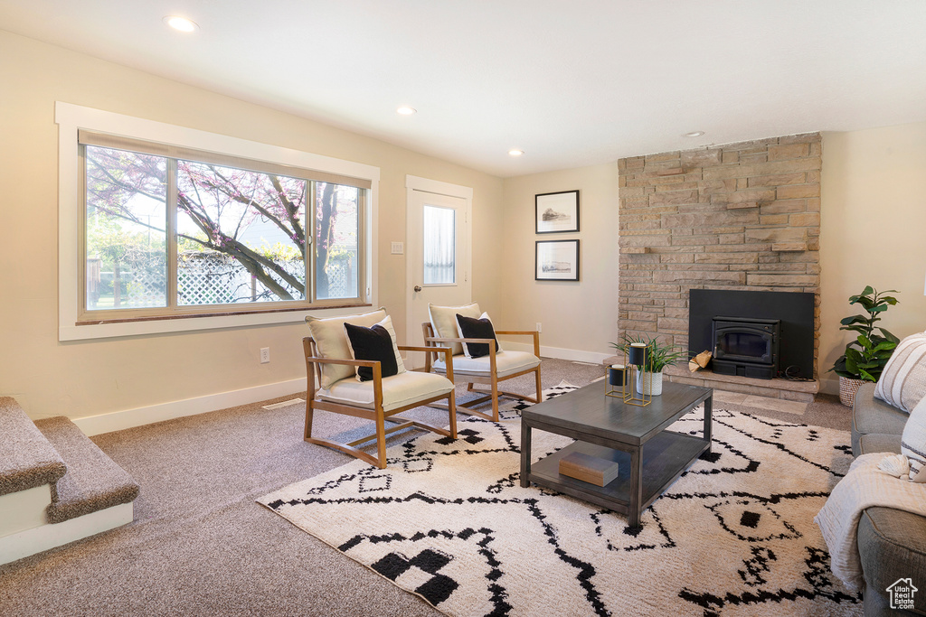 Living room with baseboards, recessed lighting, and carpet floors