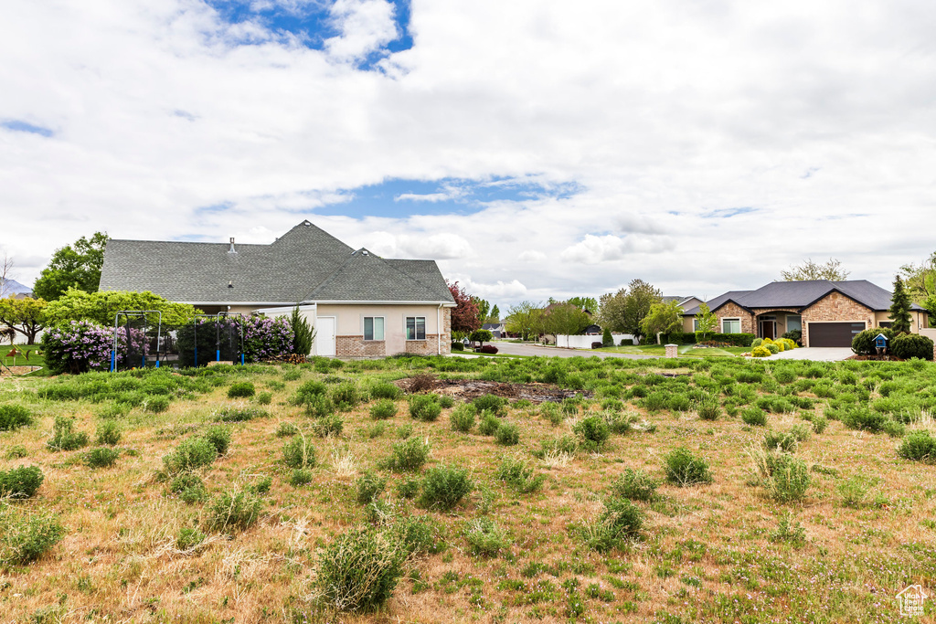 View of yard with a garage