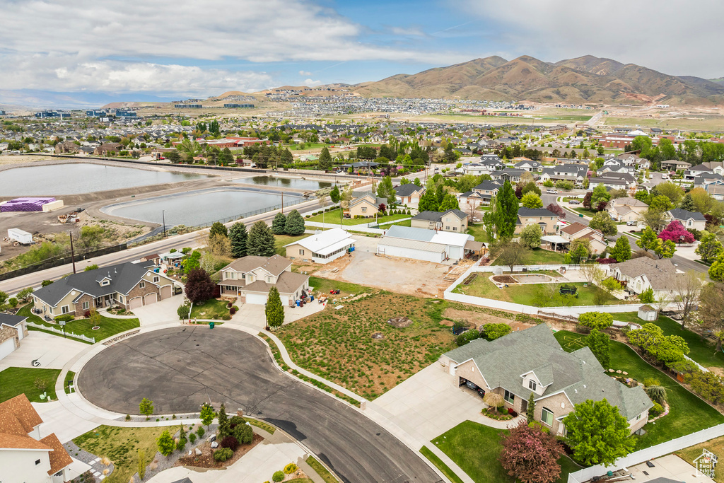 Birds eye view of property featuring a residential view and a water and mountain view