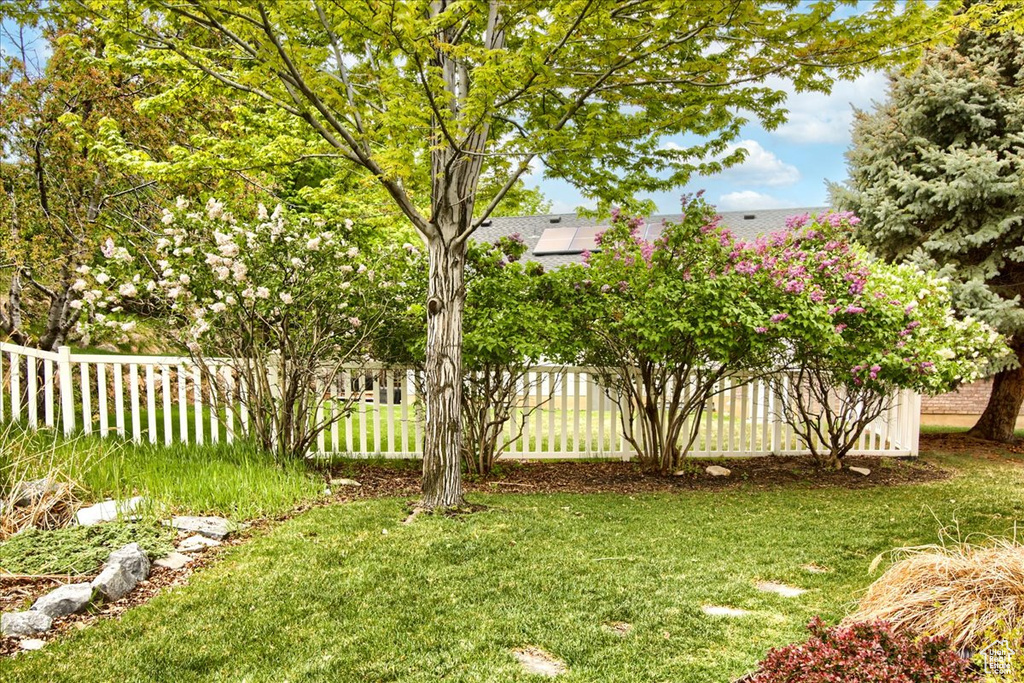 View of yard featuring fence