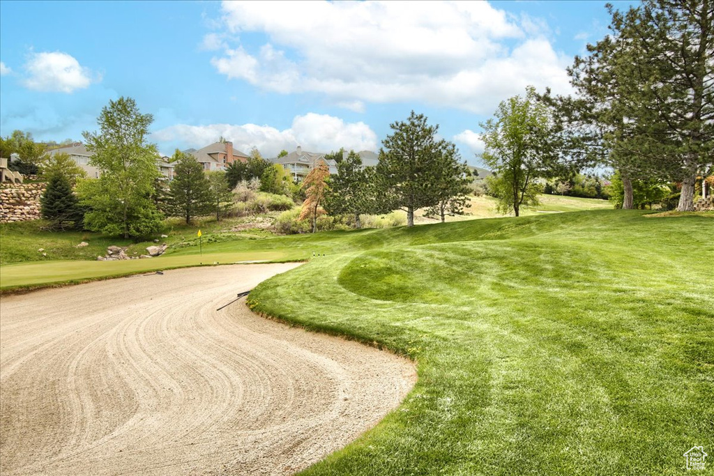 View of property\\\'s community featuring a lawn and golf course view