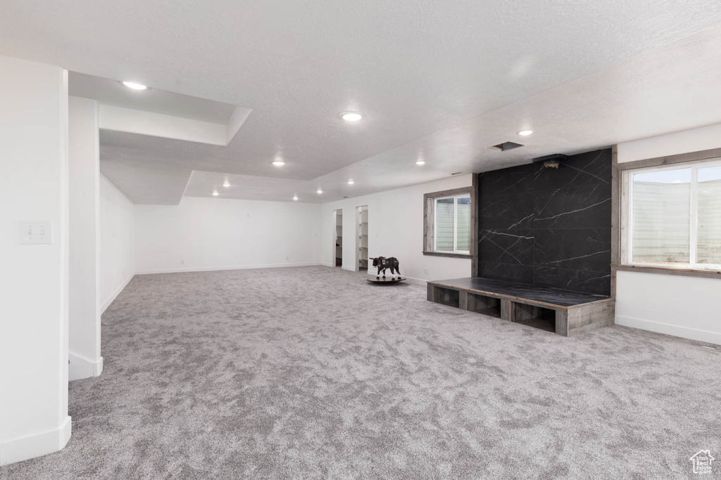Basement with carpet flooring, recessed lighting, and baseboards