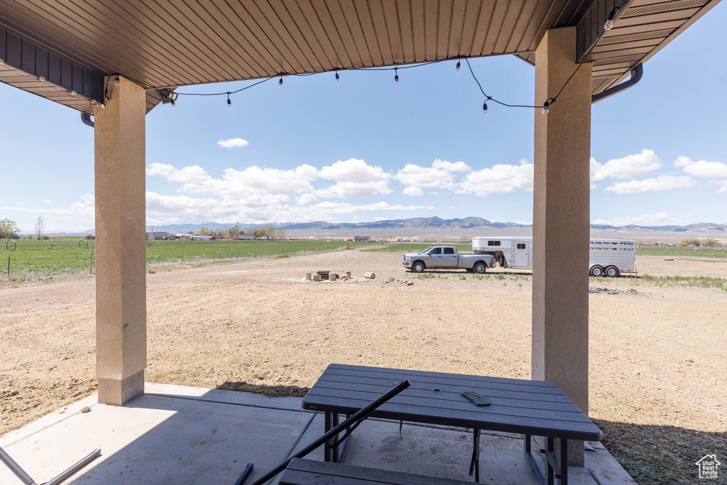 View of patio with a mountain view and a rural view