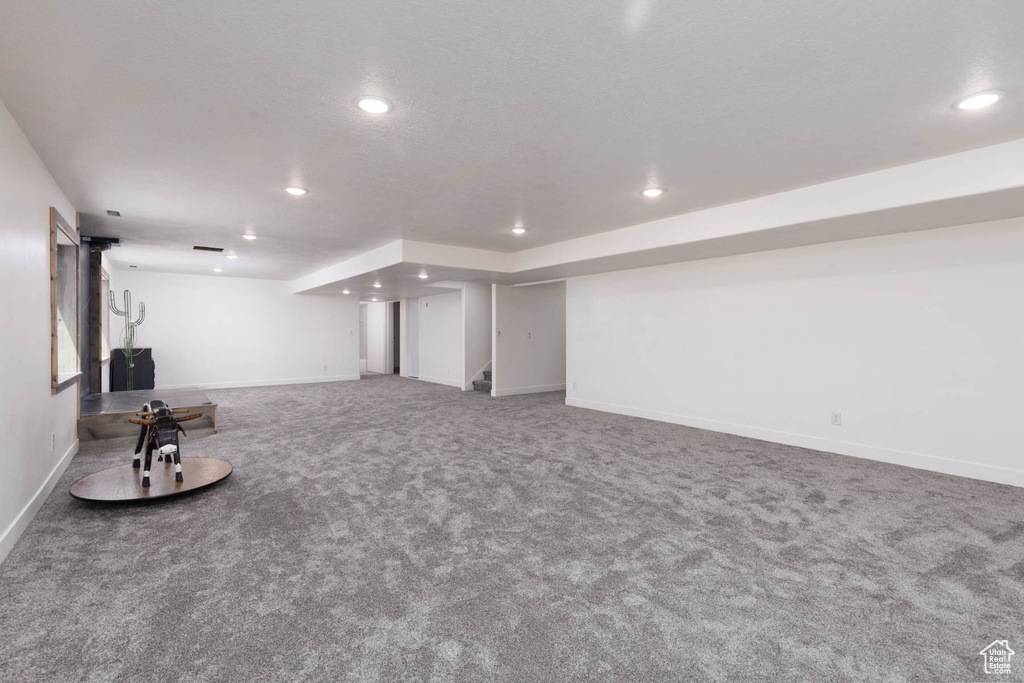 Finished basement with recessed lighting, baseboards, and carpet floors