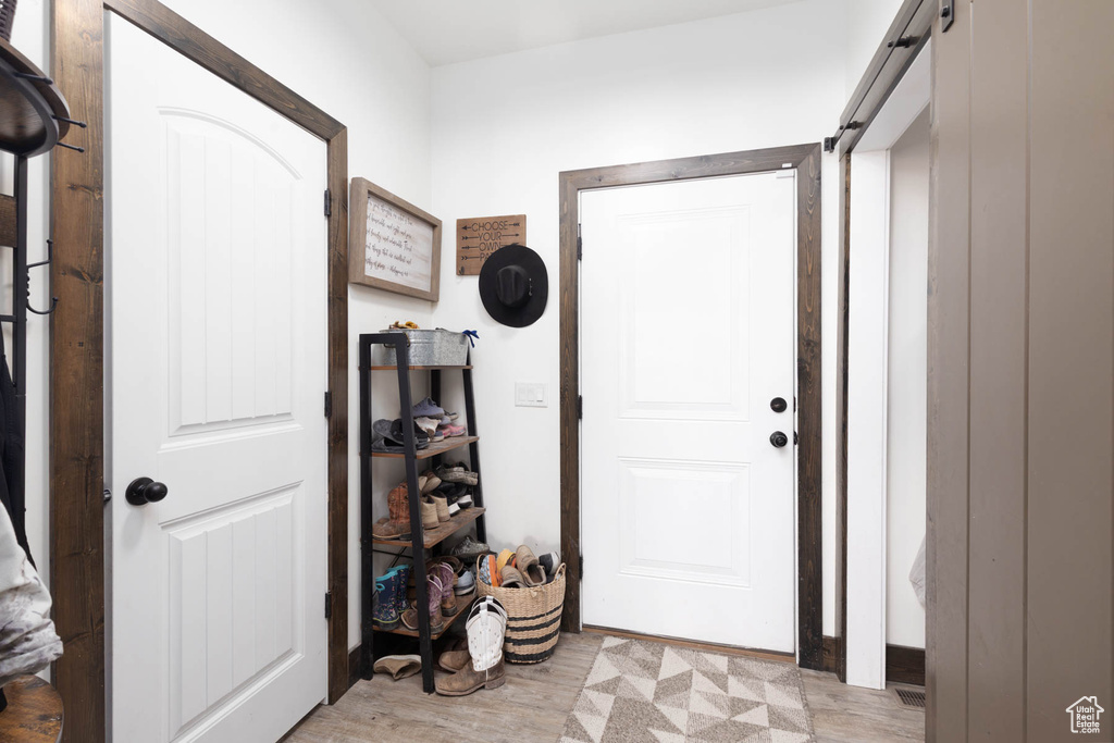 Foyer with light wood-style flooring