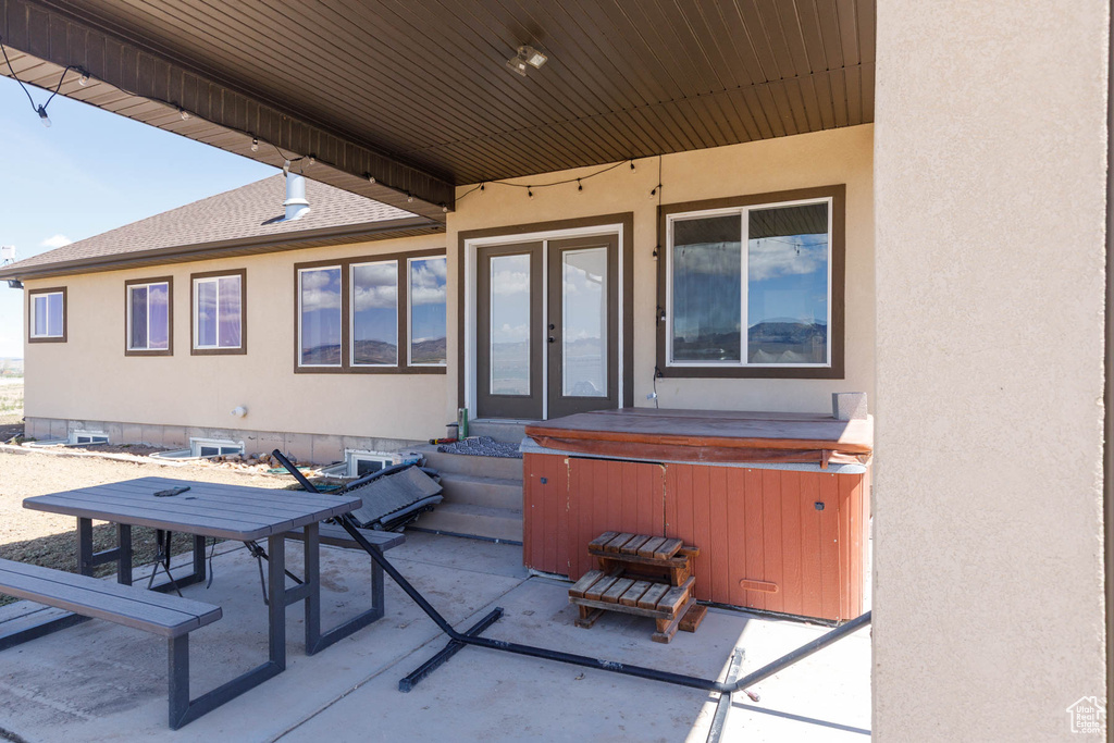View of patio featuring a hot tub