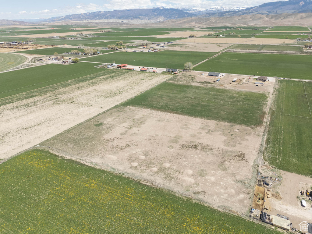 Birds eye view of property with a mountain view and a rural view