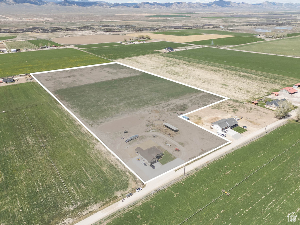 Aerial view featuring a rural view and a mountain view