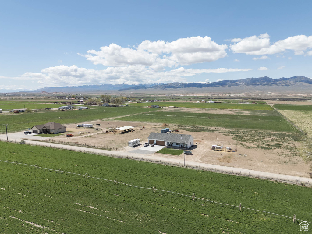 Birds eye view of property with a mountain view and a rural view