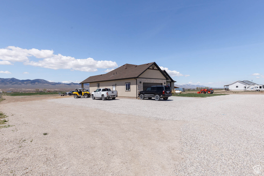 Exterior space featuring a garage and a mountain view