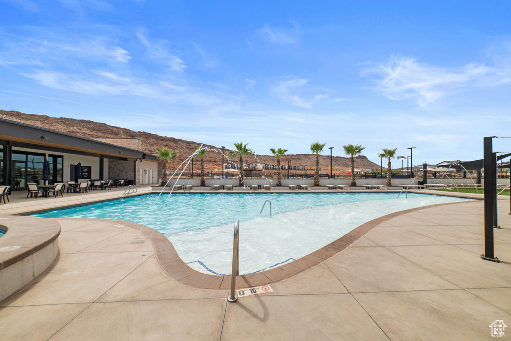 Community pool with a patio area