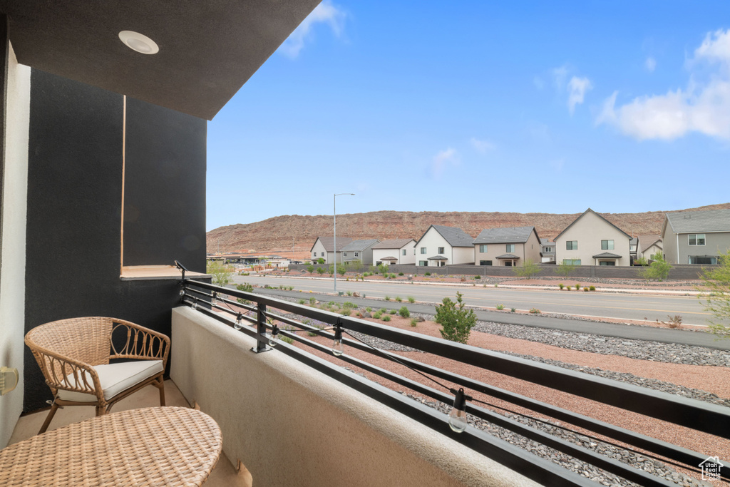Balcony with a residential view and a mountain view