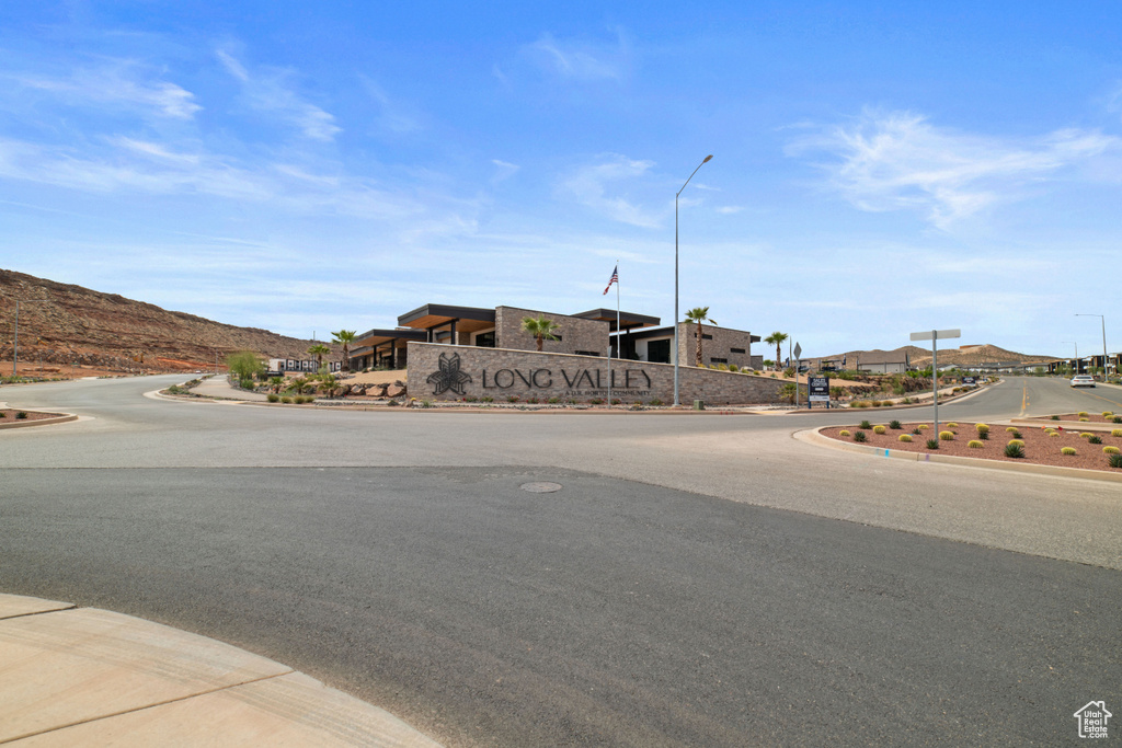 View of road with street lights and curbs