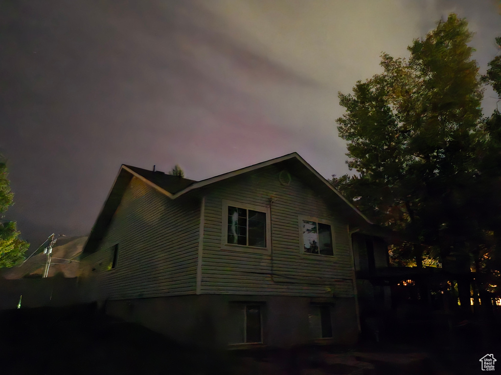View of property exterior at dusk
