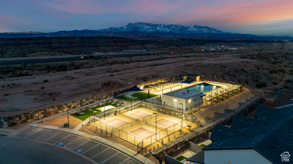 Aerial view at dusk with a desert view and a mountain view