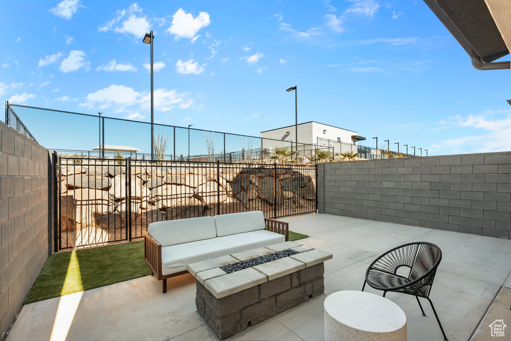 View of patio / terrace featuring a fenced backyard and an outdoor fire pit