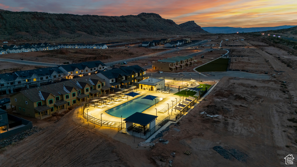 Aerial view at dusk featuring a mountain view