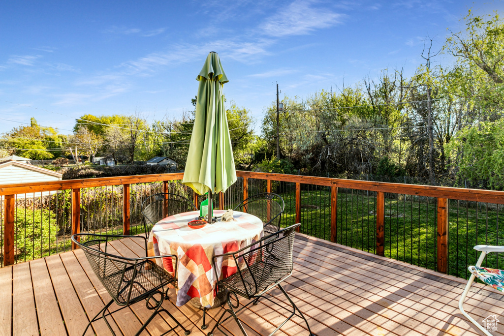 Wooden terrace featuring outdoor dining space