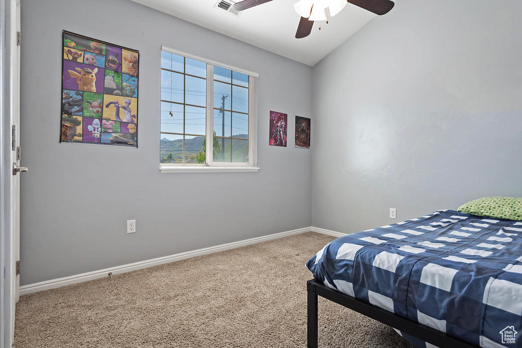 Bedroom with carpet flooring, a ceiling fan, baseboards, and visible vents
