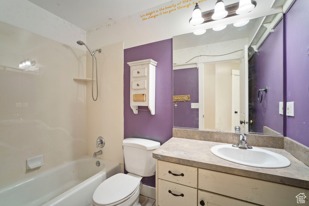 Full bath with vanity, toilet, and tub / shower combination