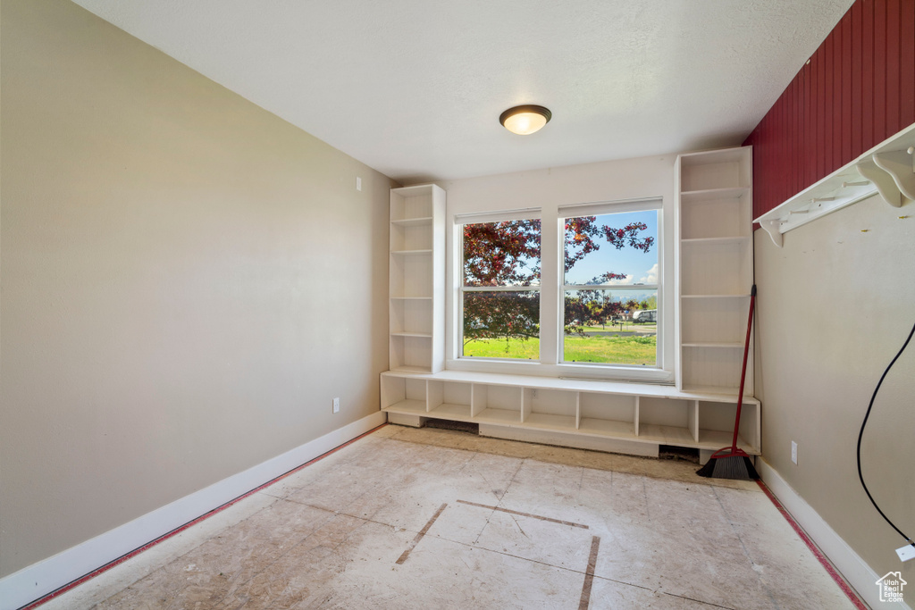 Unfurnished room with baseboards