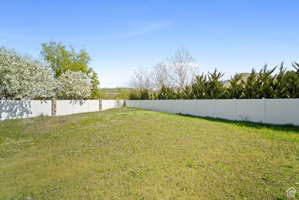 View of yard with fence