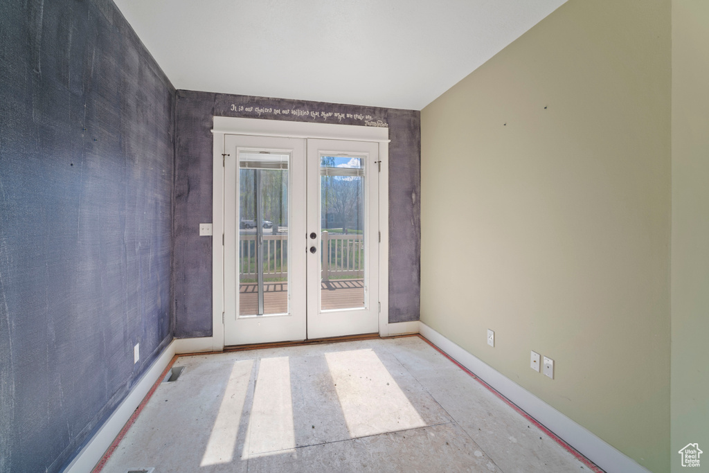 Entryway with baseboards and french doors