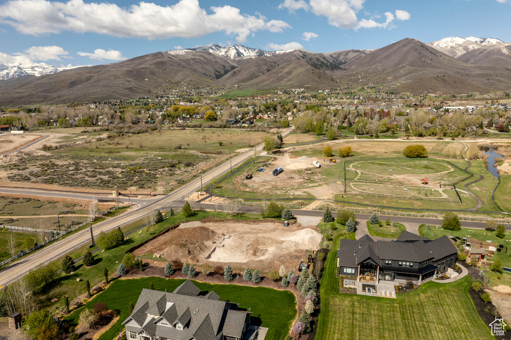 Birds eye view of property with a mountain view