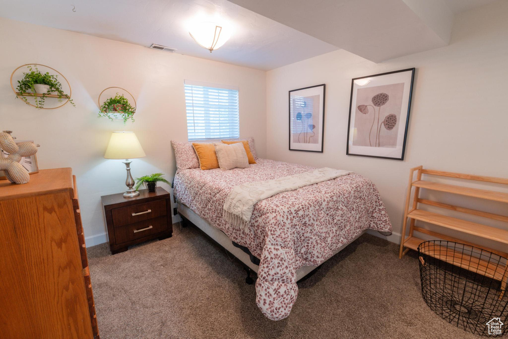 Bedroom featuring visible vents and carpet