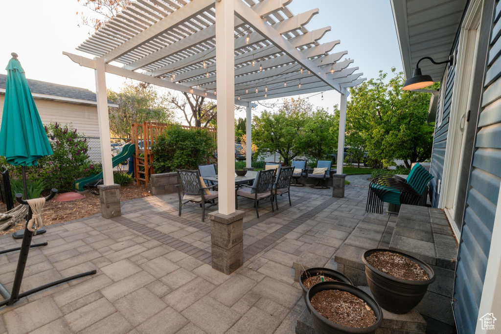 View of patio / terrace featuring outdoor dining area and a pergola