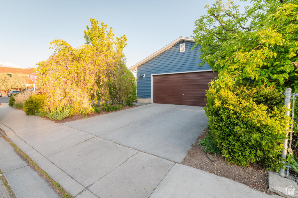 Exterior space featuring concrete driveway