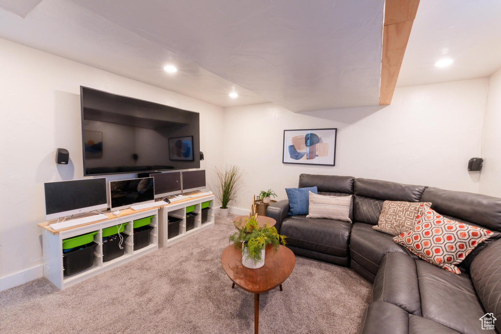 Carpeted living area featuring baseboards and recessed lighting
