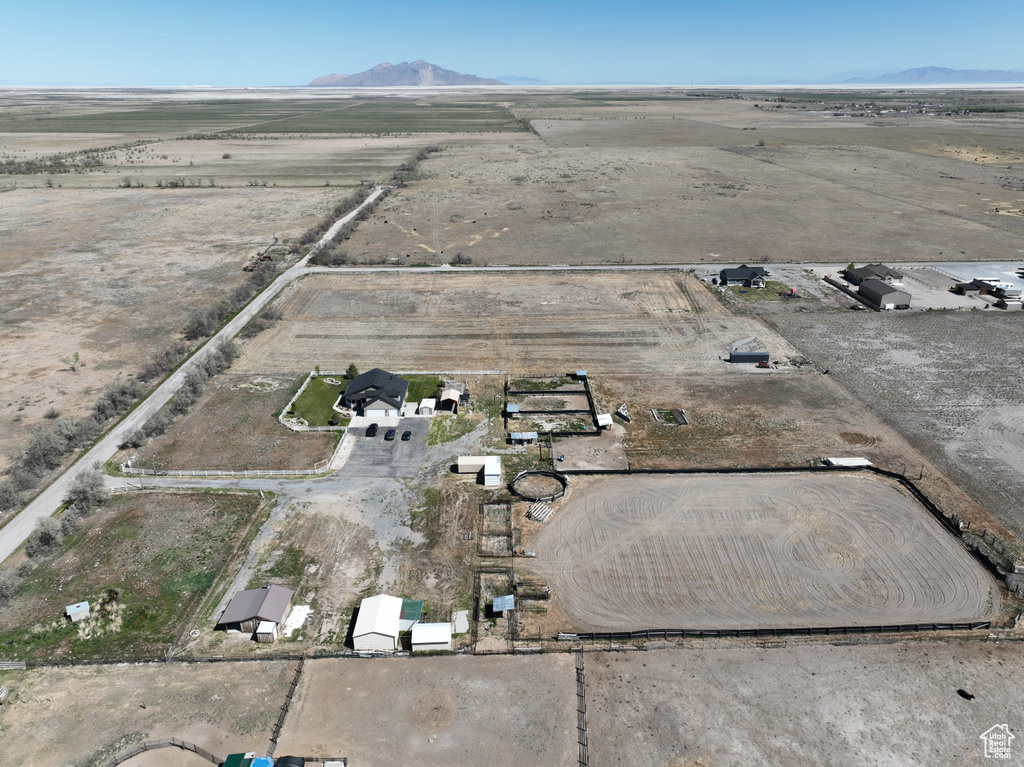 Birds eye view of property with a rural view and a mountain view