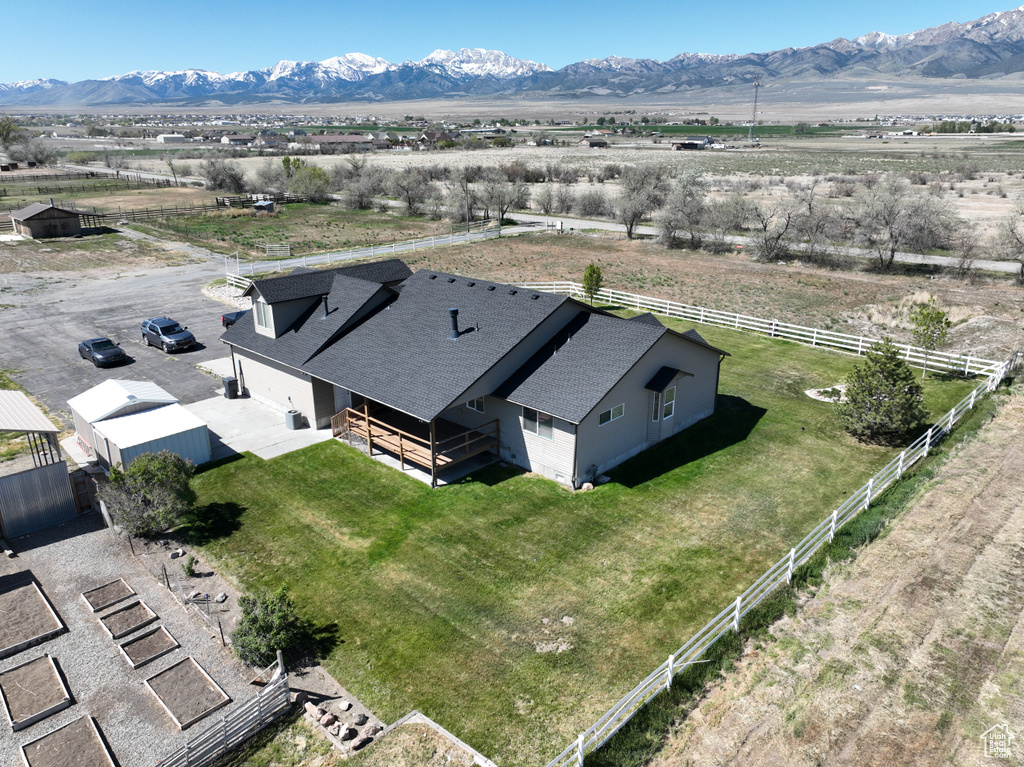 Birds eye view of property with a mountain view and a rural view